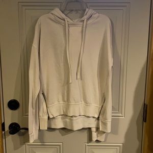 White hoodie with zippers on bottom